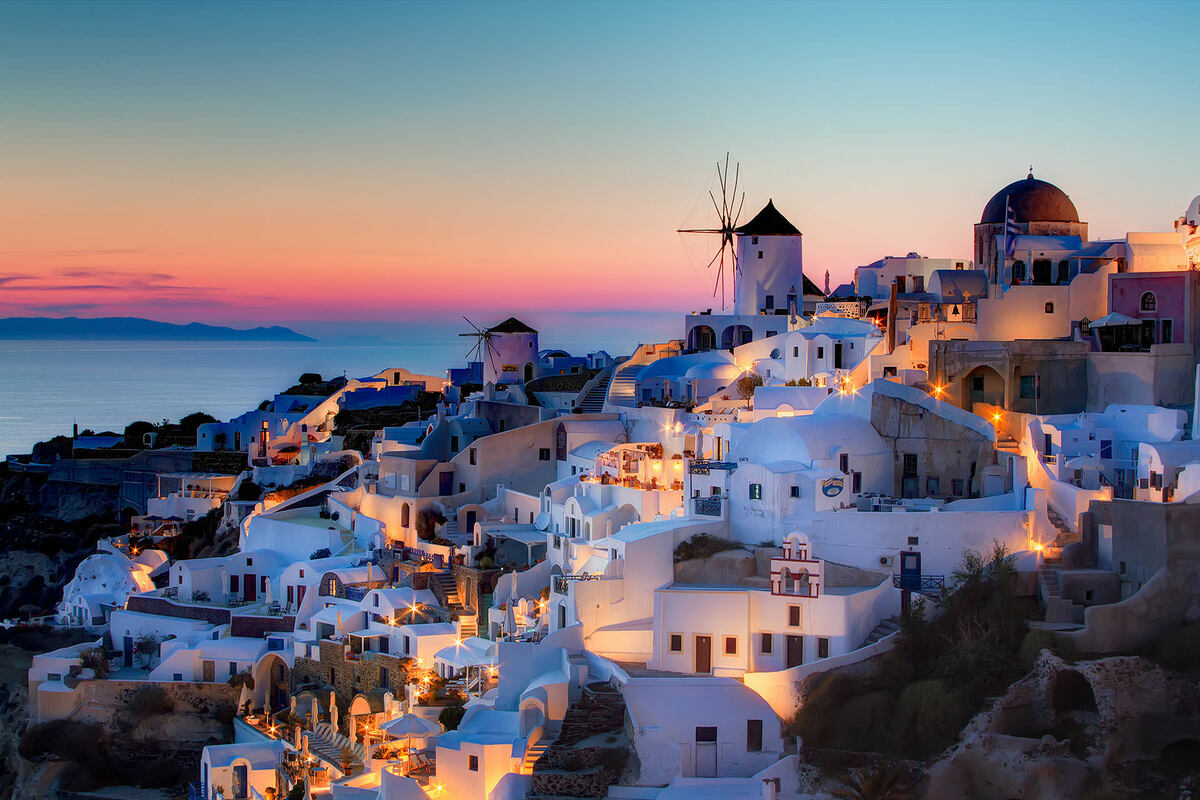 Watch the sun slowly setting in the Aegean Sea